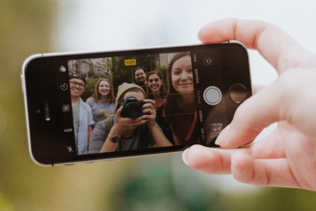 Person recording a person taking a picture