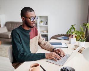 Man sitting and working on computer