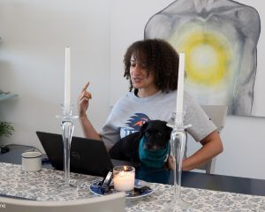 Shalita Myrick gesturing while looking at computer