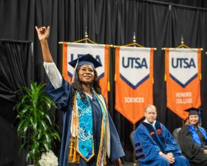 Student crossing the stage at graduation